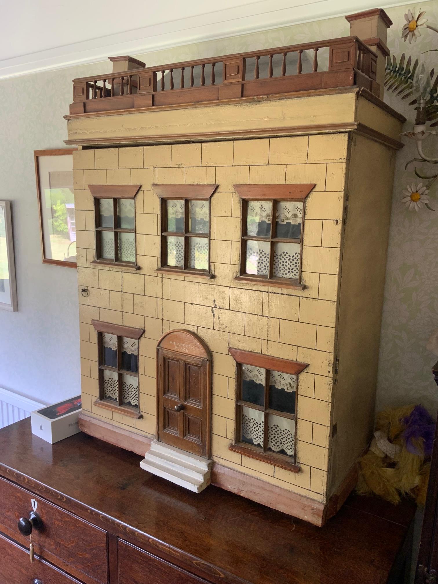 A early 20th century George III style doll’s house ‘Hinxworth Place’, together with extensive furnishings, height 97cm, width 72cm, depth 35cm. Condition - fair.